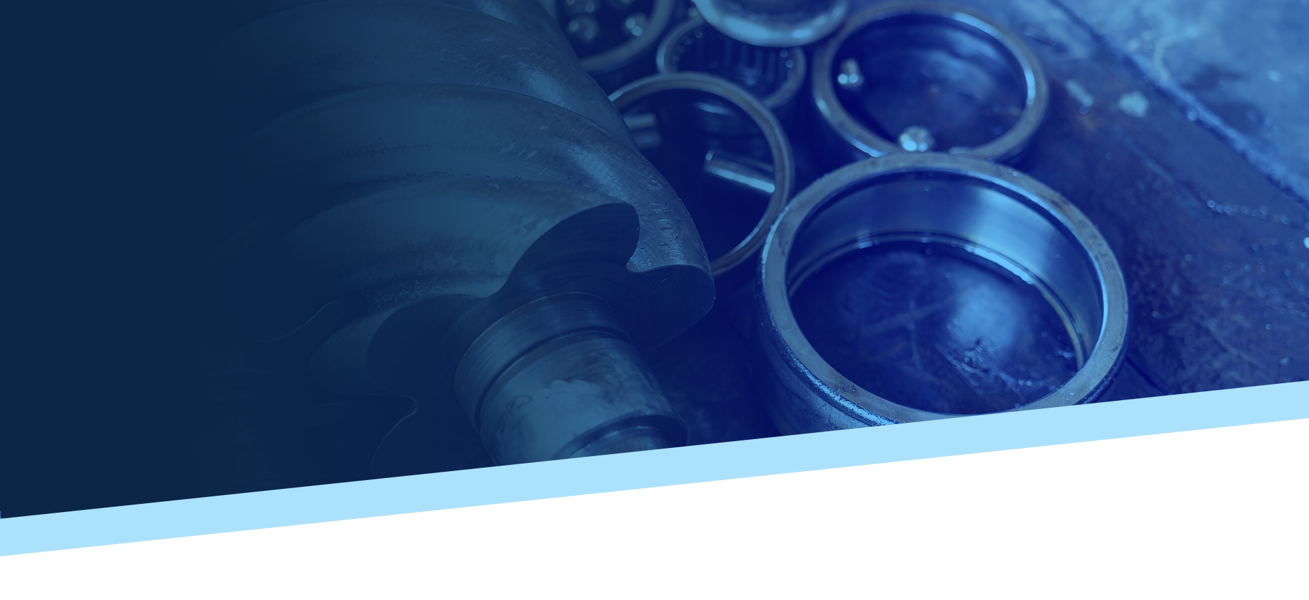 Bearings and a rotary screw airend screw on a table with a heavy blue gradient overlay